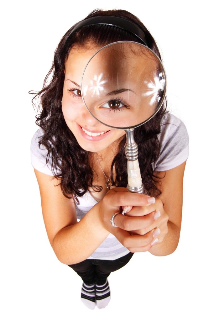 Girl with magnifying glass